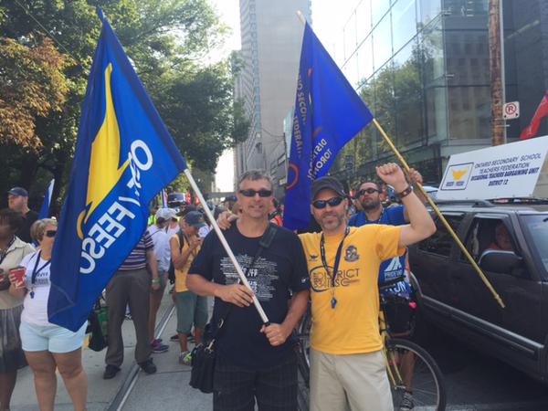 OSSTF Treasurer Earl Burt (L) and District 34-ILSC President Mark Dallas (R) turned up to join thousands in the march.